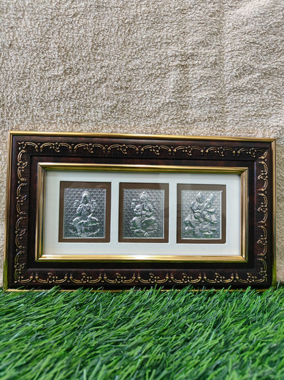 Lord Ganesha, Lakshmi and Saraswati Devi Photo Frame (H - 7" , W - 11" ) - 999 Silver